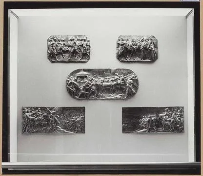 Showcase with metal objects: five baseliogs of driven silver; Halls of cra... Stock Photos