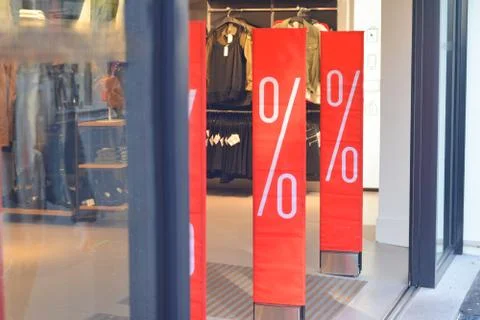 Showcase shops with a red stand about sales Stock-Fotos