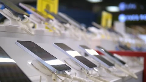 Showcase of a tech store or exhibition with new models of phones of different Stock-Footage 312603755