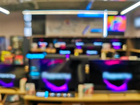 Showcase with TV sets in the modern electronics store. Fotos Stock