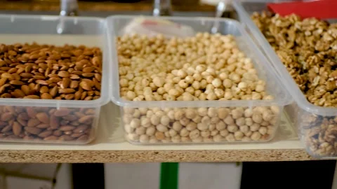 Showcase of various nuts on oriental bazaar. Georgian market. Video stock 213570701