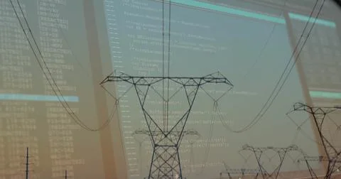 Showcasing high-voltage tower silhouette in rural field at dusk, with power Stock Photos