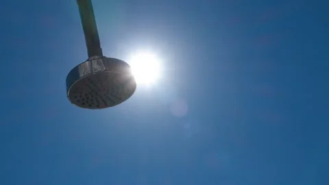 Shower on the background of the blue sky and the sun Stock Footage 250554581