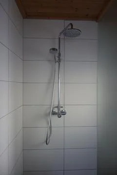A shower in a bathroom Stock Photos