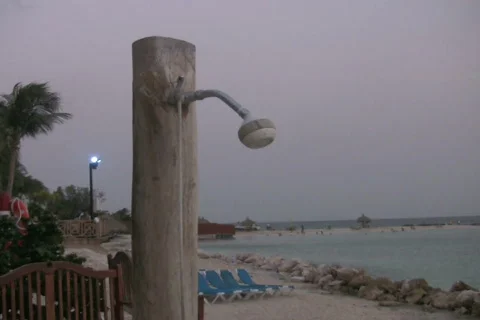 Shower on the beach NTSC Stock Footage 320762