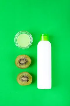 Shower gel with kiwi on green. Stock Photos