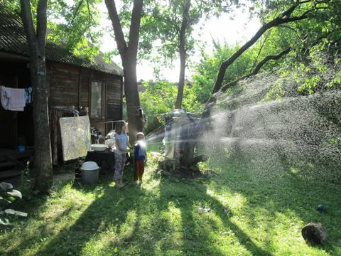 Shower for the grass in the villa Stock Photos