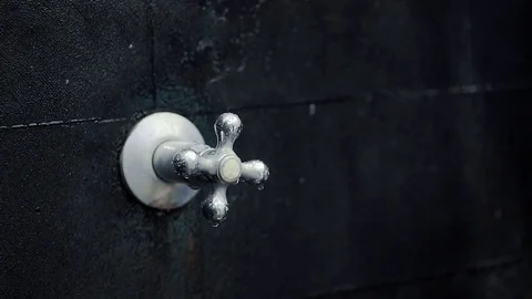 Shower handle with water falling in the darkness Stock Footage 71574445
