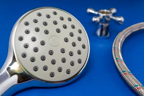 Shower head on a blue background. Stock Photos