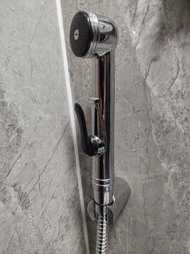 Shower head on a grey marble background. Stock Photos