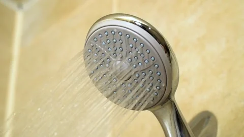 Shower head, macro view. Water drips, pours a stream into the bath. New showe Video stock 221852897