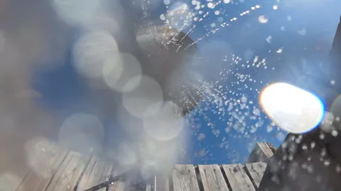 Shower head spraying refreshing water from above, contrasting with a clear blue Stock Footage 342761467
