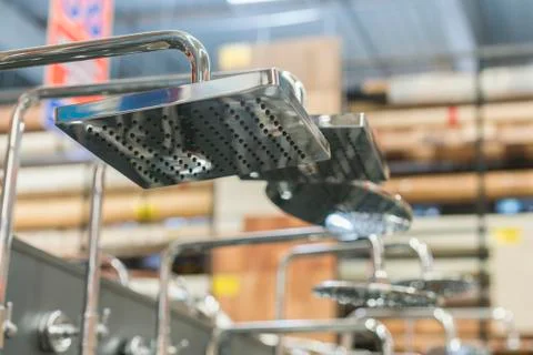 Shower head on the stand in a hardware store. selected focus. set of shower h Stock Photos