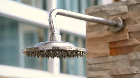 Shower head turning on and off, inside swimming pool area. Stock Footage 51314404