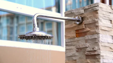 Shower head turning on and off, inside swimming pool area. Stock Footage 51314631
