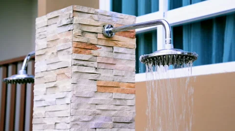 Shower head turning on inside swimming pool area. Stock Footage 51314210