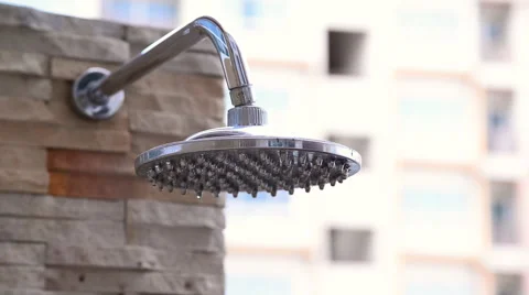 Shower head turning on inside swimming pool area. Stock Footage 51314672
