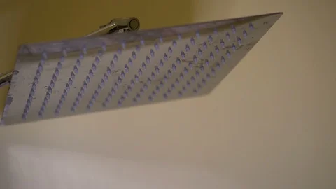 Shower head turning on in slow motion Stock-Footage 127147920