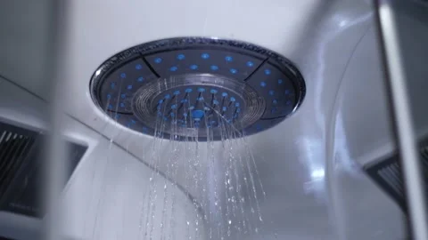 Shower head turning off.Water droplets falling in the shower cabin slow motion. Stock Footage 220833862