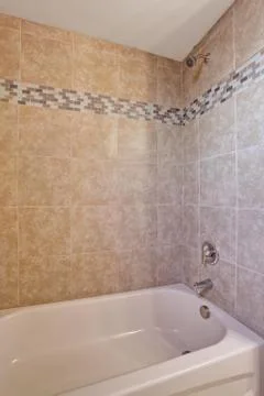 Shower of medium sized bathroom. Stock Photos
