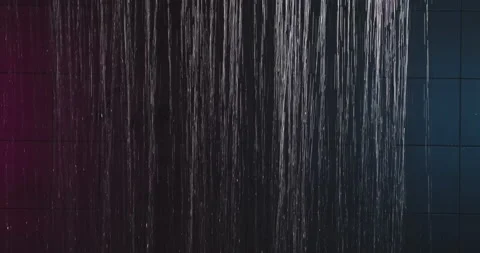 Shower in neon light. Water running in the shower in pink and blue light. Slow Stock Footage 256285726