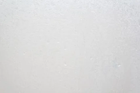 Shower screen with drops on a light background Stock Photos