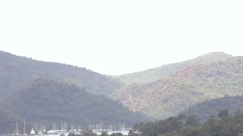 Shower, sky, mountains, forest and the yacht Marina Stock Footage 40647218