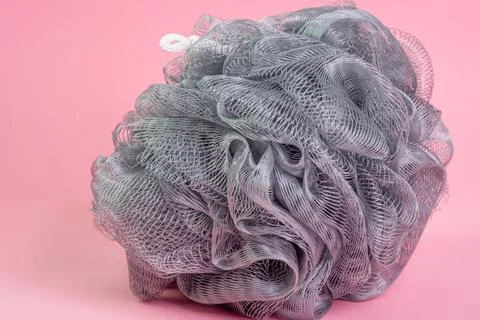 Shower sponge on pink background Stock Photos