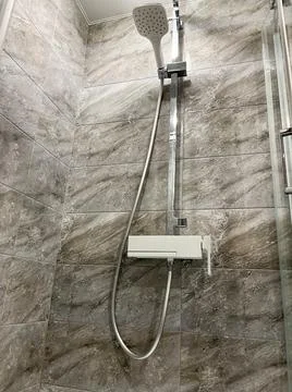 Shower system in the bathtub close-up Stock Photos