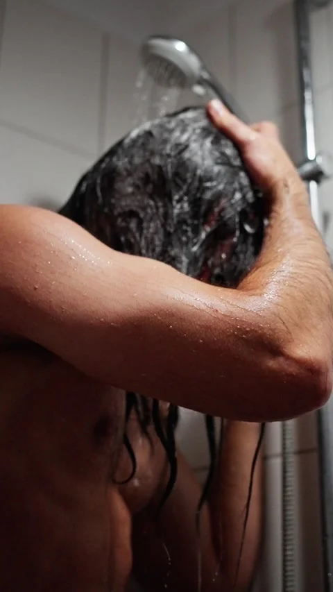 Showering Vigorously After Intense Exercise Session, Man Vigorously Rinses Sweat Stock Footage 323093844
