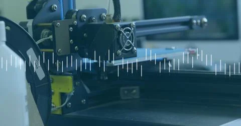 Showing 3D printer extruder assembly over empty print bed at maker workspace, 写真素材