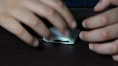 Showing the Card reader and SDHC card together Stock Footage 128198783