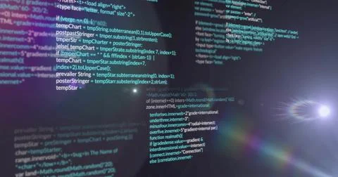 Showing centered syntax-highlighted code lines in dim workspace, with lens flare Stock-Fotos
