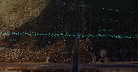 Showing central road intersection crossing arid landscape, showing teal data 스톡 사진