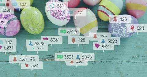 Showing cluster of decorated Easter eggs sitting on worn turquoise table, with Stock Photos