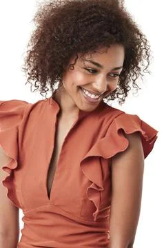 Showing off a demure style. Cute young african american woman looking away shyly Stock Photos