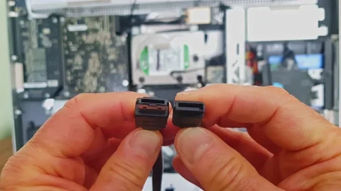 Showing differences between an e-SATA connector (on the left) and a SATA Stock Footage 200098450