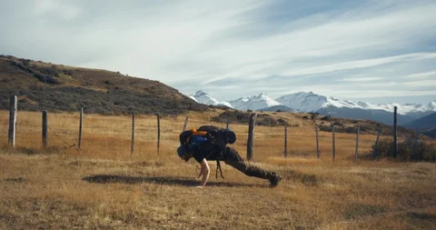 Showing off doing push-ups with backpack Stock Footage 90403961