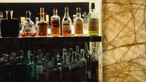 Showing of drinks on the shelf in bar Stock Footage 129928276