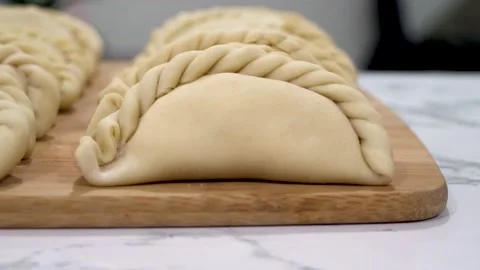 Showing empanadas (Focus - B Roll) Stock Footage 205969107