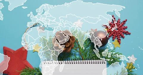 Showing flatlay featuring notepad and pinecone on turquoise background with Stock Photos