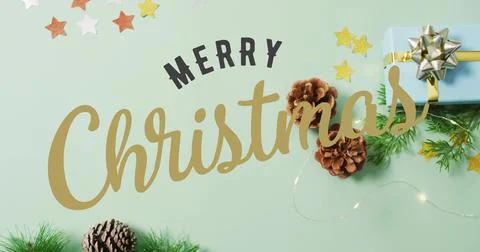 Showing gold Christmas script, black MERRY lettering on mint tabletop, with b Stock Illustration