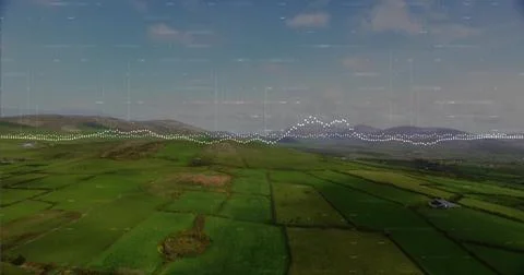 Showing green fields stretching over rural farmland from above, with waveform 库存照片