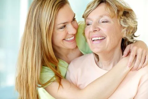 Showing her affection and appreciation. A beautiful woman hugging her mother Stock Photos
