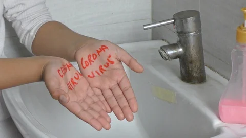 Showing how to wash hands to clean Corona Virus text message on the palms. Stock Footage 126270772