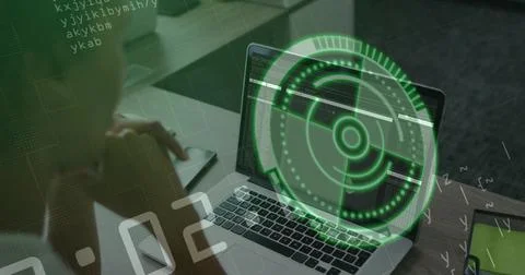 Showing laptop with code and green HUD at desk, forearms wearing dark sleeves, 写真素材