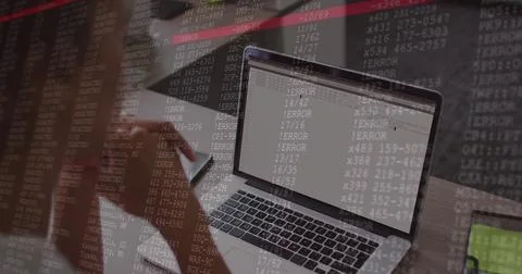Showing laptop ERROR and code overlay on desk, green-screen tablet, blurred 스톡 사진