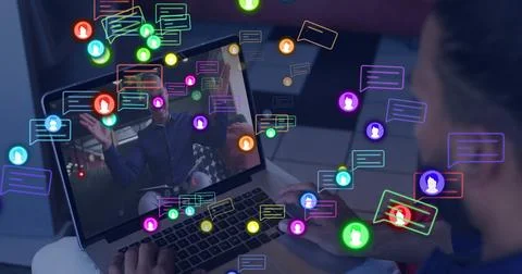 Showing laptop screen with onscreen man gesturing at home, viewer in blue shirt Stock Photos