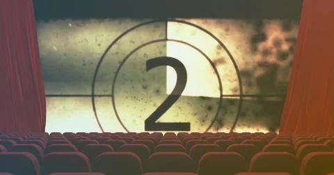 Showing large projection screen counting down number two in cinema auditorium, 写真素材