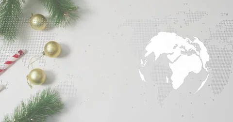 Showing left-cluster resting on gray table 3 baubles, candycane, dotted-map and Stock Photos